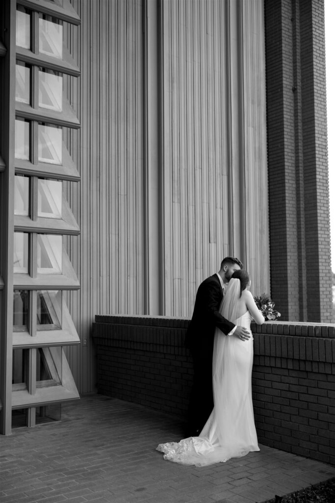 Candid moment between bride and groom moments after they got married in Dallas Texas